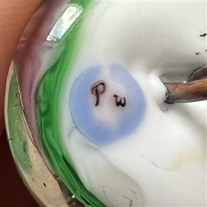 Pati Walton glass studio paperweight button of a flower.