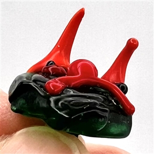 Jacques Israel lamp worked glass studio button of a funny face with horns.