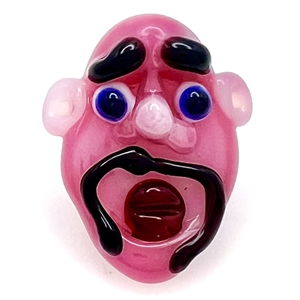 Drew Ebelhare lamp worked glass studio button of a face.