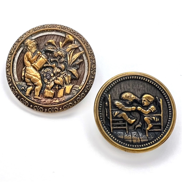 Two wood background brass story buttons.