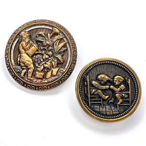 Two wood background brass story buttons.