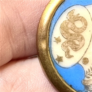 A 19th c. Polychrome painted Liverpool transfer button of Minerva/Athena.