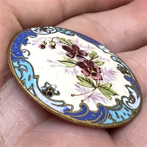 A 19th c. Enamel button of pansies with a champlevé border. 