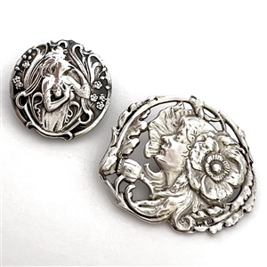 Two Art Nouveau silver buttons of women.