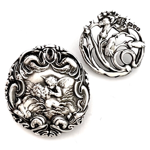 Two Art Nouveau silver buttons.