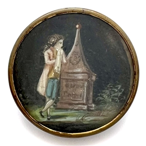An 18th c. painting on natural material button of a man who appears to be mourning.