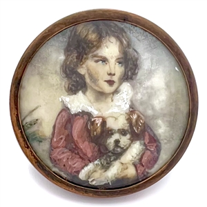 An 18th c. painting on natural material button of a young boy and his dog. 