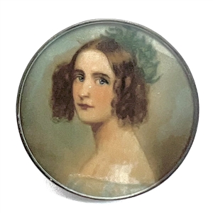 Painting of a woman on natural material under glass set in metal.