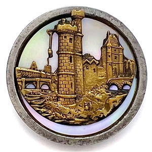 Brass escutcheon over pearl button of  “Le Tour de Nesle."