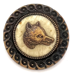Brass escutcheon of a fox head over celluloid set in brass button.