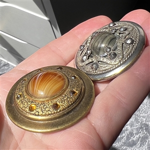 Two Victorian jewel buttons.