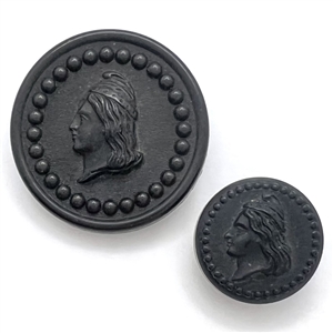 Two “Liberty Head" Goodyear rubber buttons in two sizes.