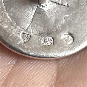 Hallmarked silver sporting button of a golfer.