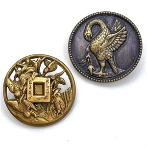Two brass buttons of birds including “the pelican in her piety."