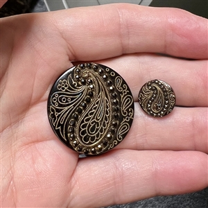 Two Lacy black glass paisley buttons in mother / daughter sizes.