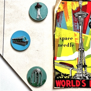 Card of six buttons and two pins from the 1962 World's Fair in Seattle.