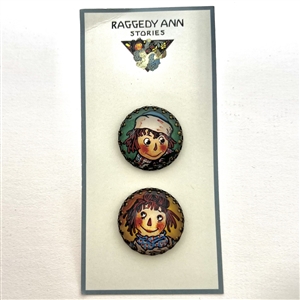 Two Raggedy Ann & Andy buttons on original store card.