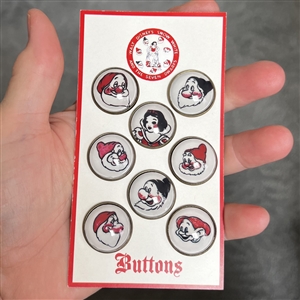Eight vintage Snow White and 7 Dwarf buttons on original store card.