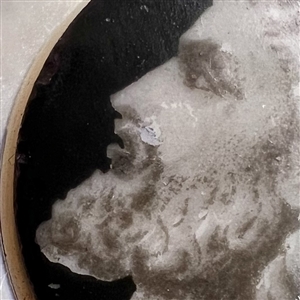 A 19th c. Liverpool transfer and painted ceramic of Greek man's head set in pearl button. 