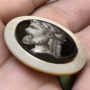 A 19th c. Liverpool transfer and painted ceramic of Greek man's head set in pearl button. 