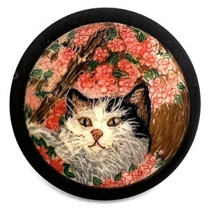 Hand painted natural material of a cat under cherry blossoms button.