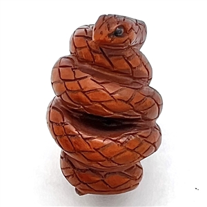 Carved boxwood coiled snake button.