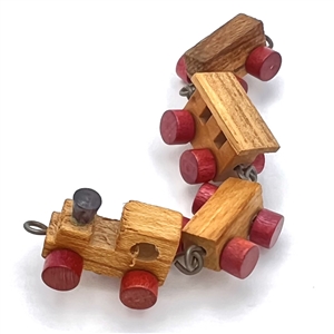 Hand made wooden train made of four buttons. 