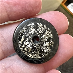 “The Reapers composition whistle-hole button with an inset of crystalized tin.