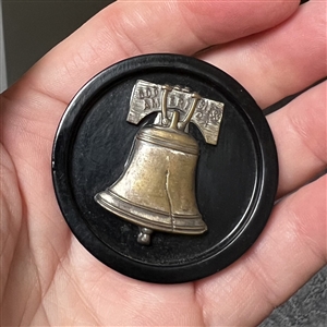 Brass over celluloid Liberty Bell button. 
