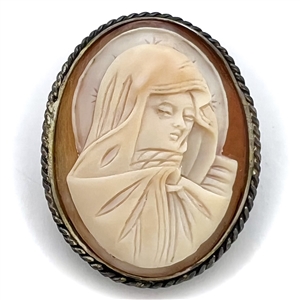 Cameo carved helmet shell set in silver button of Virgin Mary.