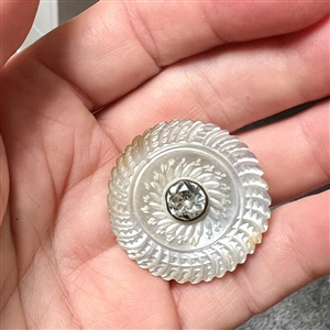 An 18th c. Carved pearl button with faceted paste center.