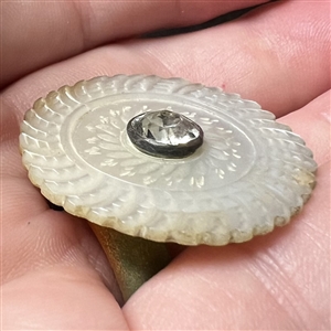 An 18th c. Carved pearl button with faceted paste center.