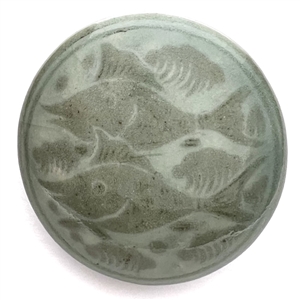 Glazed pottery obi-dome of swimming fish.