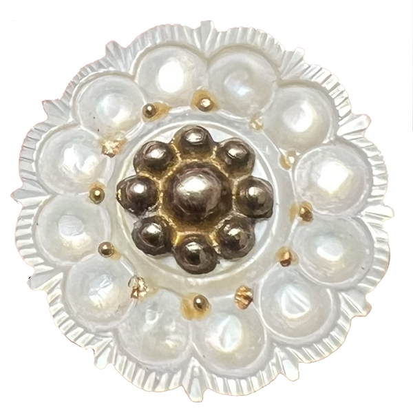 A medium size 18th c. Carved pearl button with gilded metal center.