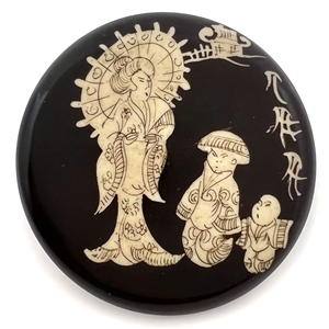 Large vintage wax resist button of Asian woman and children.