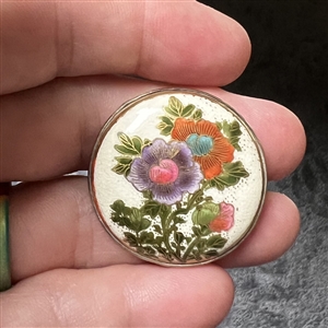 Large Satsuma button set in sliver of Clematis.