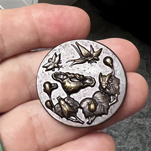 Tinted brass button of “Five Insects.