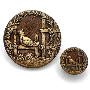 Wood background brass button of “Hen on a Fence" in mother/daughter sizes.