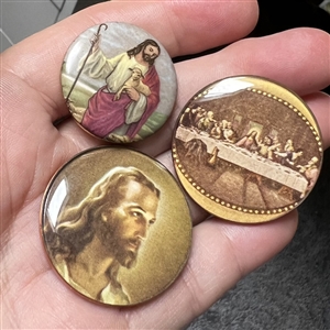 Three buttons depicting Jesus. 