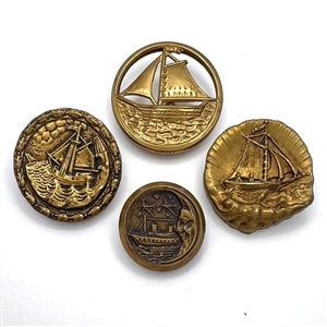 Four brass buttons of ships.