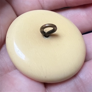 Japanese silvered metal work of a rickshaw set in natural material button.