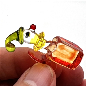 Lamp work glass studio button of a jack in the box that was a favor button for 1984 Oregon button show.