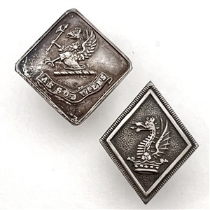 Two Livery buttons of dragons in diamond  and square shapes.