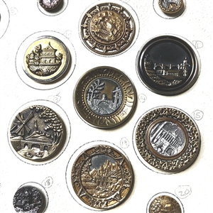 Card of twenty five architectural buttons. 