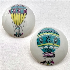 Two transfer on porcelain buttons of hot air balloons.