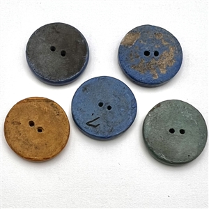 Five ceramic buttons with Mexican themes.