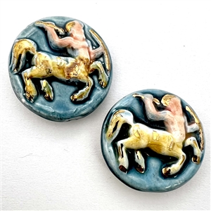 Two large glazed ceramic buttons of centaurs.