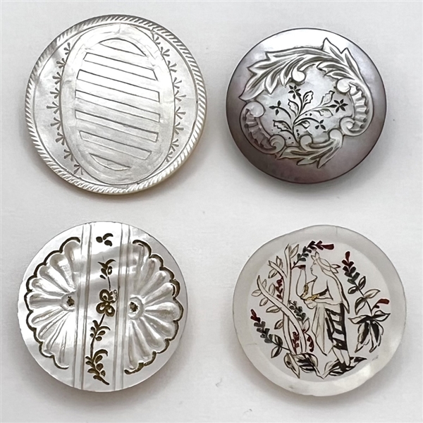 Four 19th c. Pearl and shell buttons including a woman picking fruit.