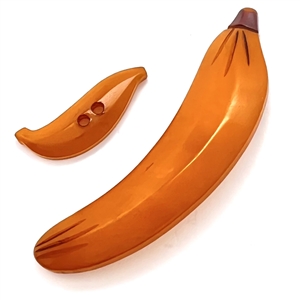 Two vintage Bakelite banana buttons.