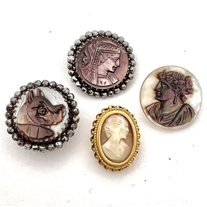 Four cameo carved pearl and shell buttons.